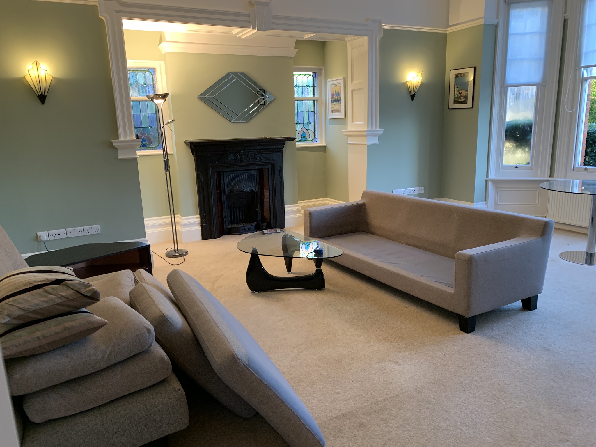 Lounge with a new cream carpet and a period fireplace