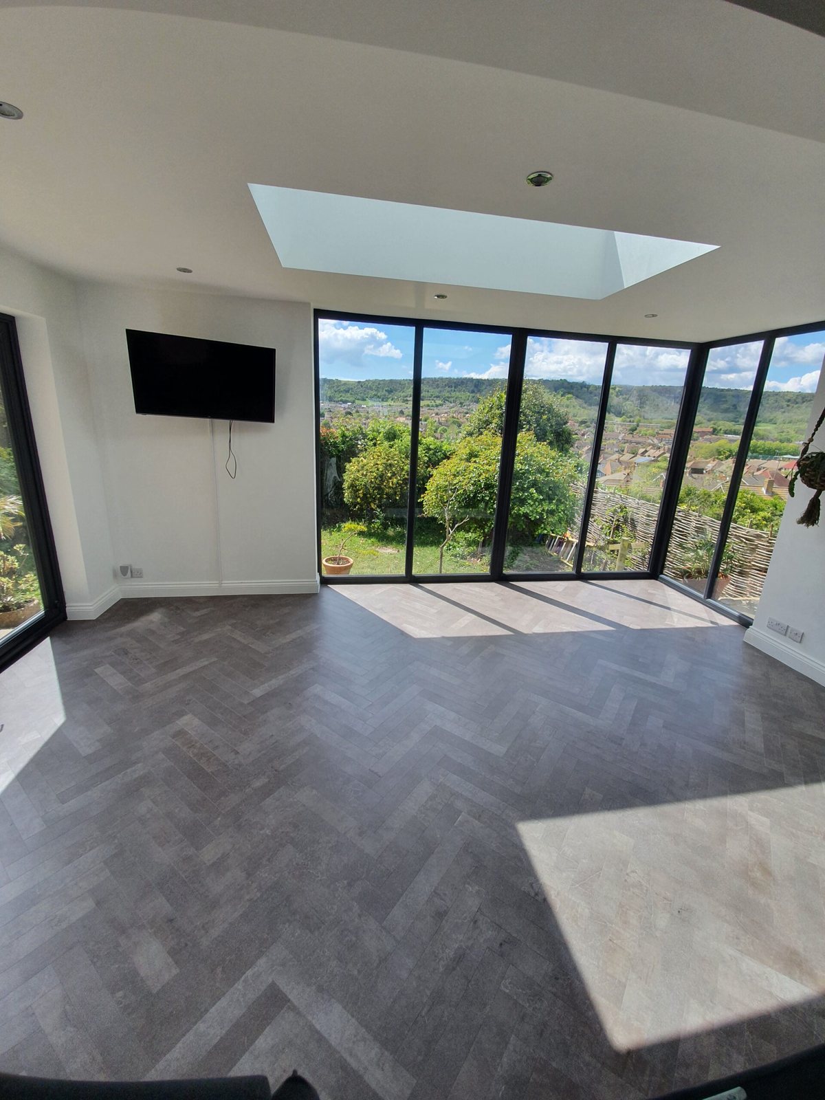 The same extension finished in a grey herringbone floor