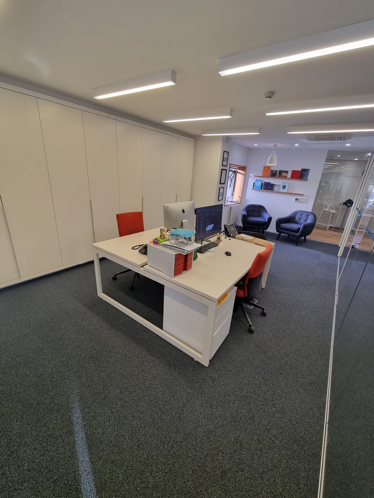 Open-plan office with new grey carpet