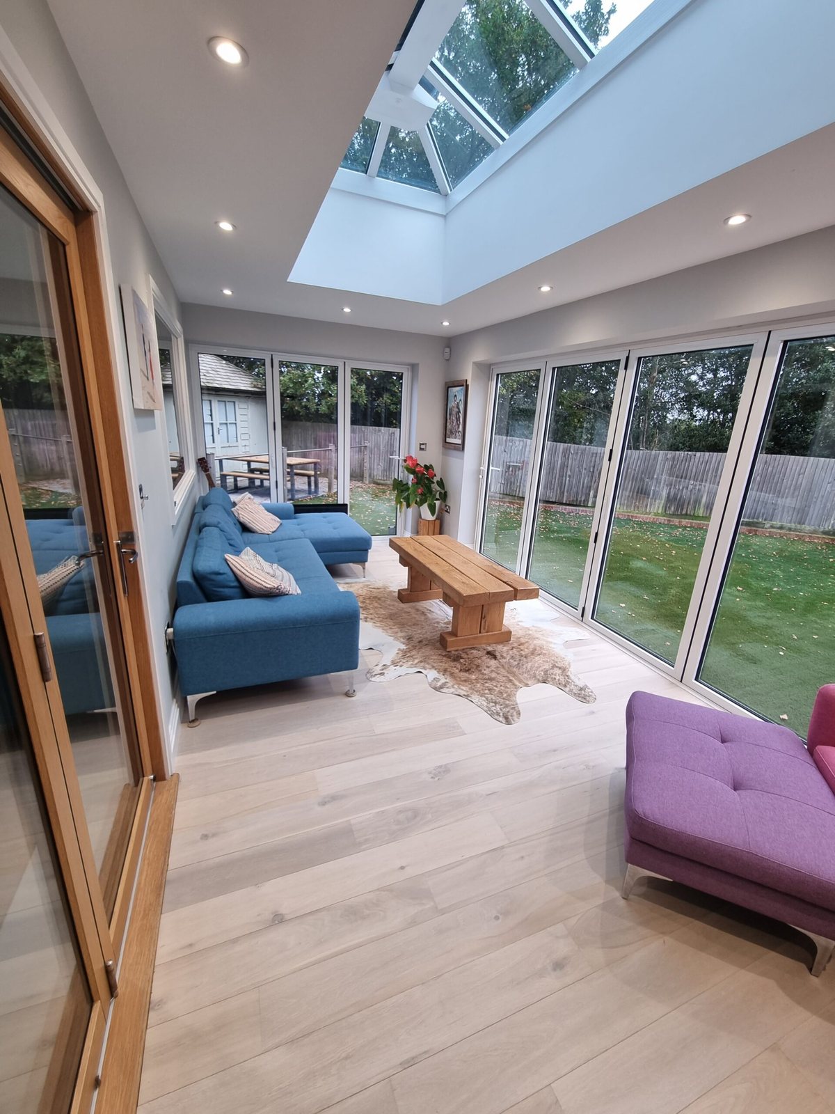 Pale oak-effect floor in a garden room