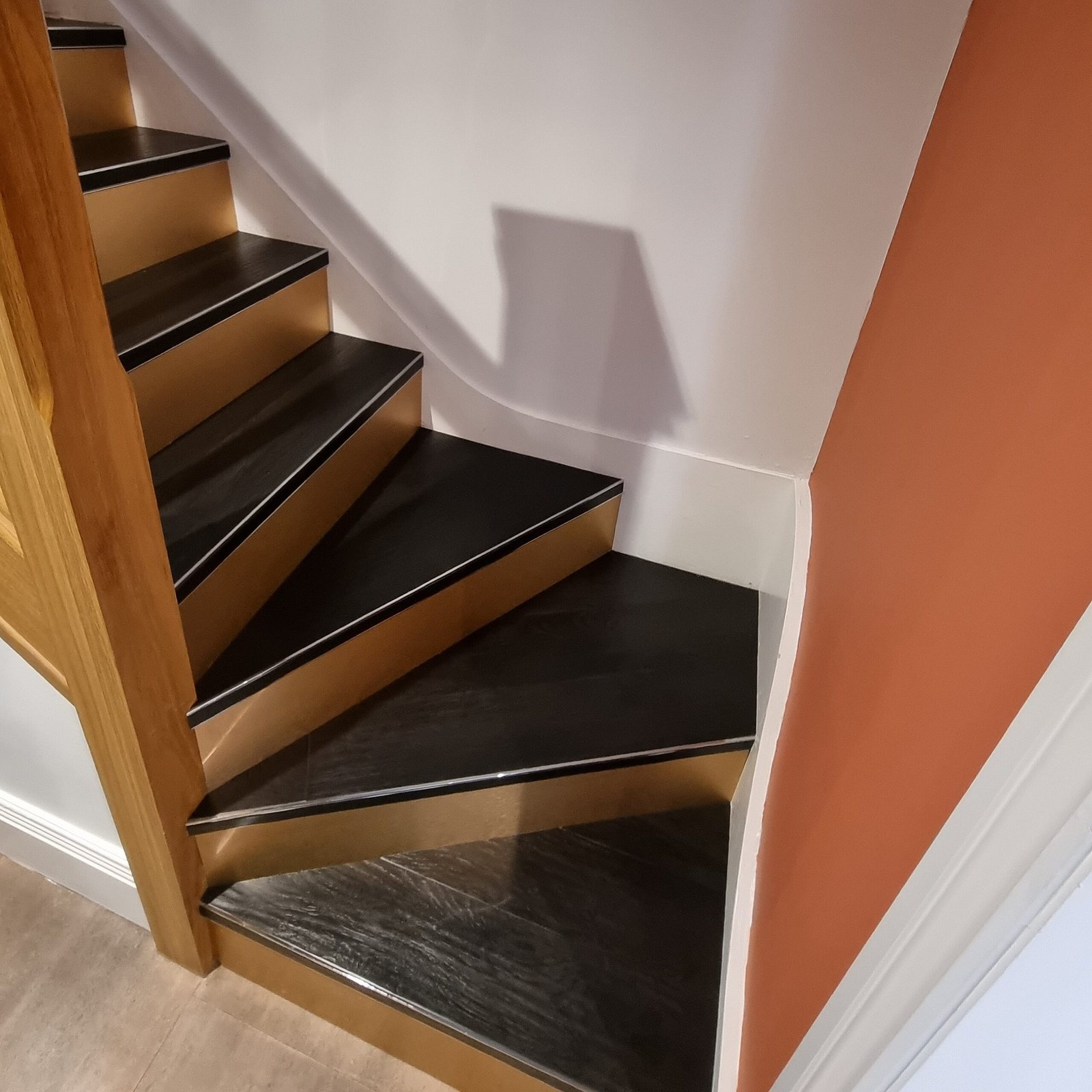 Staircase with dark treads and oak nosings